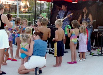Click for enlarged view. Oracle performing at the Farmington Village Pool Party