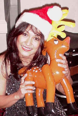 Veronica poses with her reindeer at a Holiday Party in December