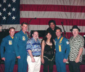 Oracle poses with members of the US Navy Blue Angels. Click for enlarged view