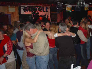 The dance floor was packed at Afterdeck during the 2nd annual Oracle Band Holiday Party. Click for enlarged view.