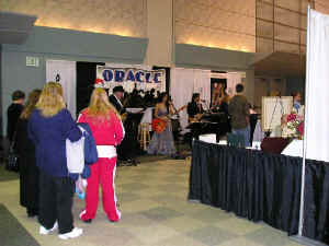 The 2005 Baltimore Bridal Showcase at the Convention Center drew almost 1000 newly engaged brides and grooms to check out vendors for their weddings. Oracle performs in our booth throughout the show.  Click for enlarged view.