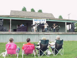 Click for enlarged view. Oracle Band performing on stage in Laurel