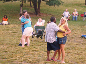 We love folks who will dance whenerver the mood strikes, like these folks at the 2008 Laurel Lakes concert