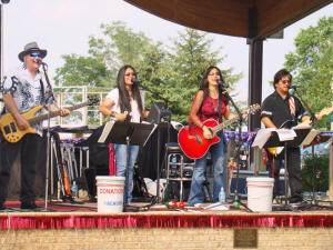 The front line of the band on stage at the Laurel Independence Day concert & fireworks celebration