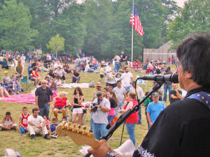 Mike looks out at the crowd listening to the Oracle Band as we perform prior to the fireworks display