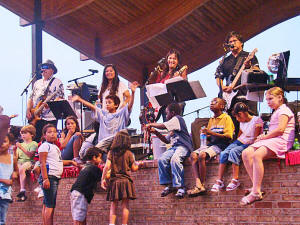 The kids were having a blast hanging out on the front of the stage with the band. Who knows how many budding musicians were up there listening?
