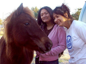 Veronica & Nikki with wild pony at Assateague Island