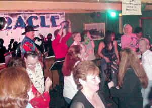We love to bring folks up on stage with the band. Click for enlarged view.