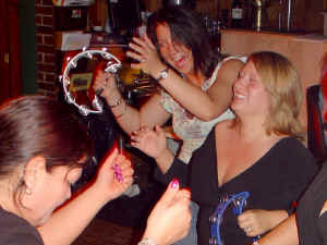 Dancers grab tambourines and join the band at Perry's Restaurant in Odenton Maryland