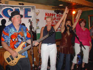 We love bringing folks up on stage with the band to help us party! Click for enlarged view.