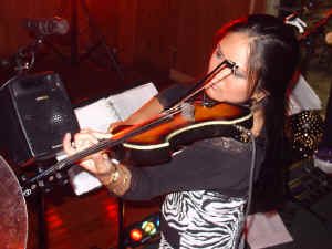 Nikki Herrera on electric fiddle. Click for enlarged view