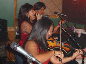 Violinist / Fiddle player Nikki Herrera joins Oracle on stage at Perry's Restaurant. Click for enlarged view
