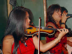 Nikki performs with the band at Perry's Restaurant. Click for enlarged view