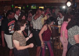 Click for enlarged view. Dancers hit the floor for a classic line dance