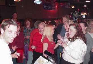 Click for enlarged view. The ladies line up to "return" the keys to Jeff's place. Can you believe the grin on Jeff's face?