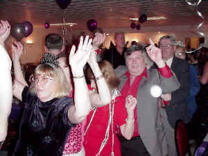The conga line stretched all the way aroiund the room as Oracle celebrated the New Year 2005 at the American Legion in Severna Park Md. Click for enlarged view.